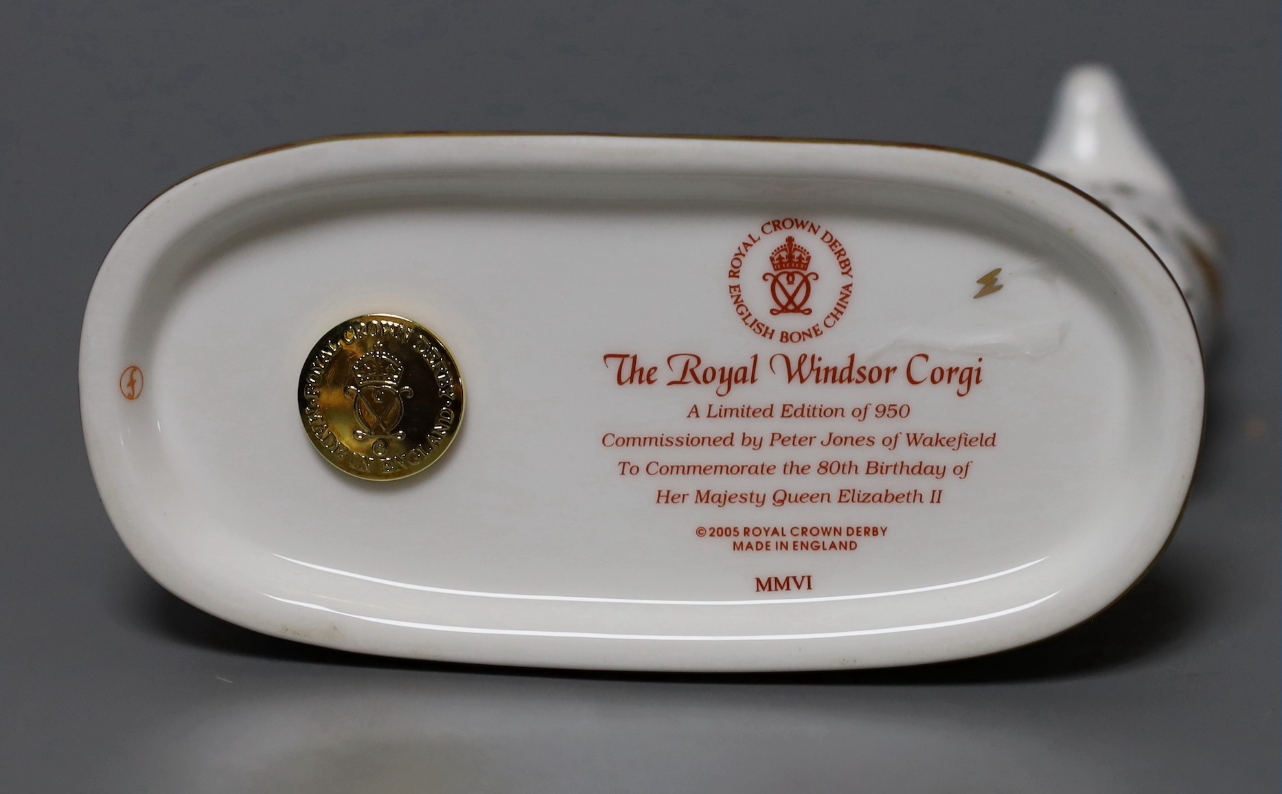 A Royal Crown Derby paperweight - Royal Windsor Corgi, gold stopper, boxed with certificate
